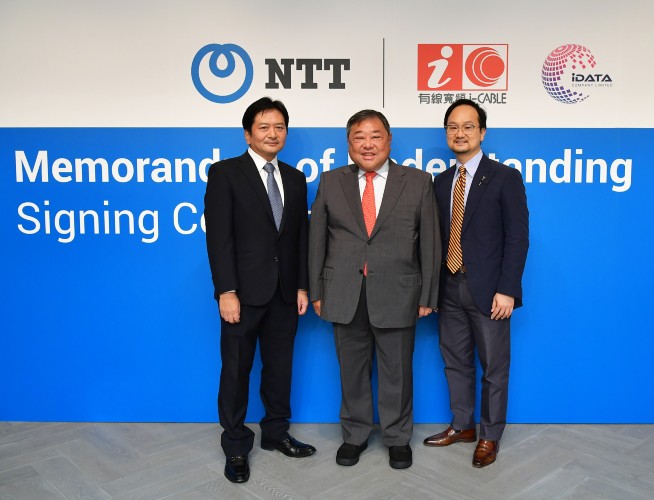 NTT team at a signing ceremony